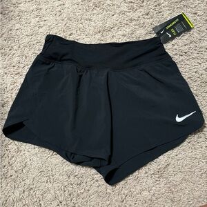 Black Nike running shorts